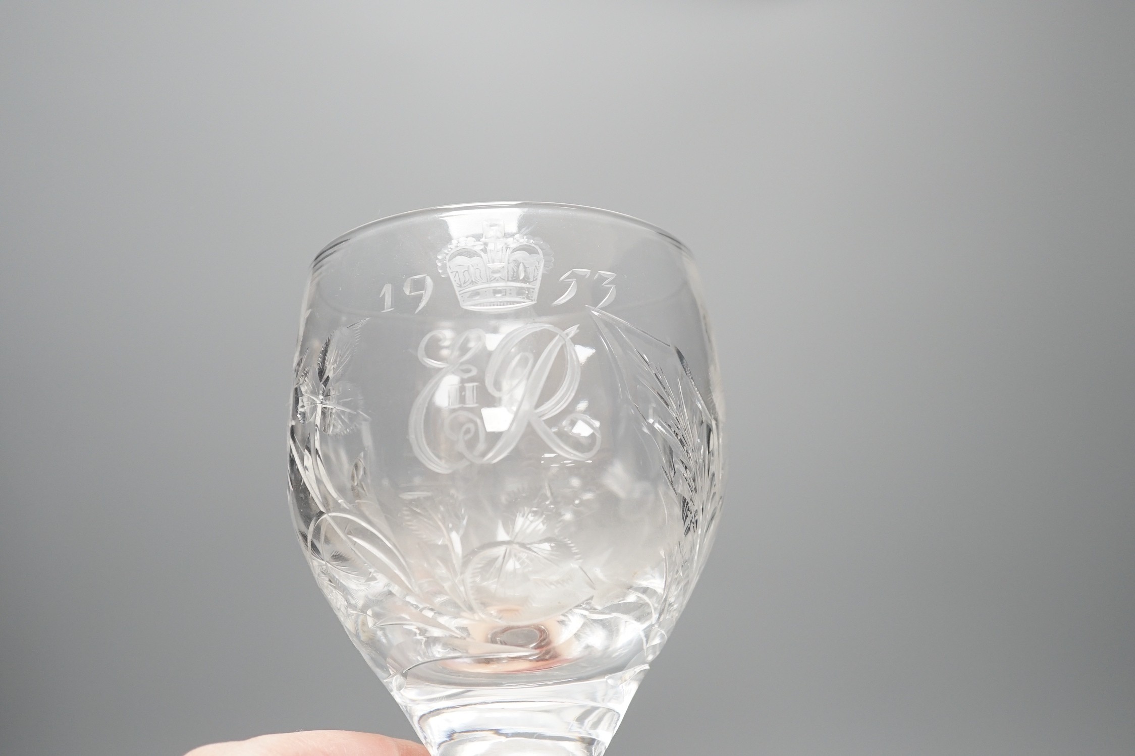 A set of four commemorative 1953 ER II coronation etched wine goblets, 14cms high